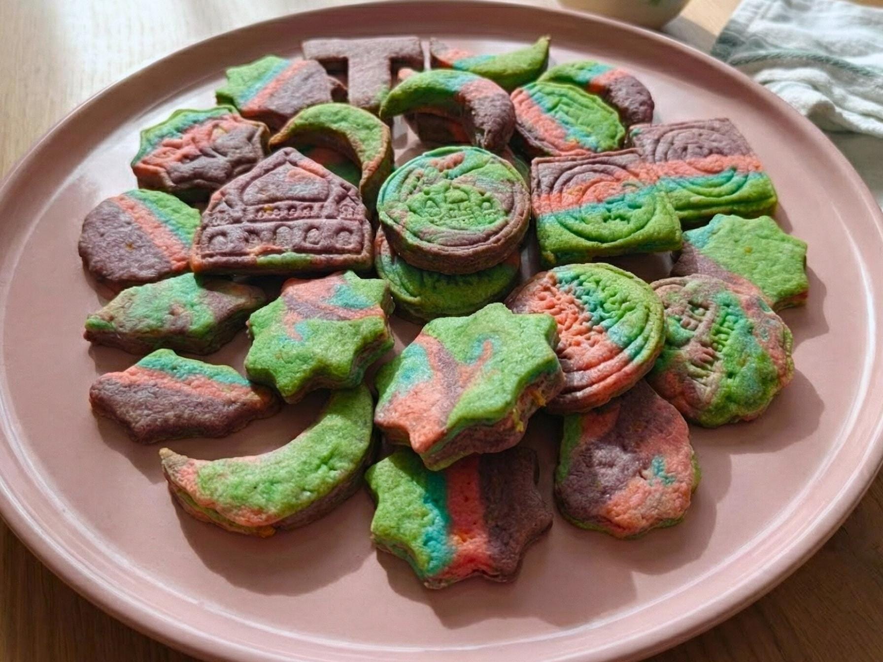 moon and star shaped Ramadan butter cookies served on a pink plate